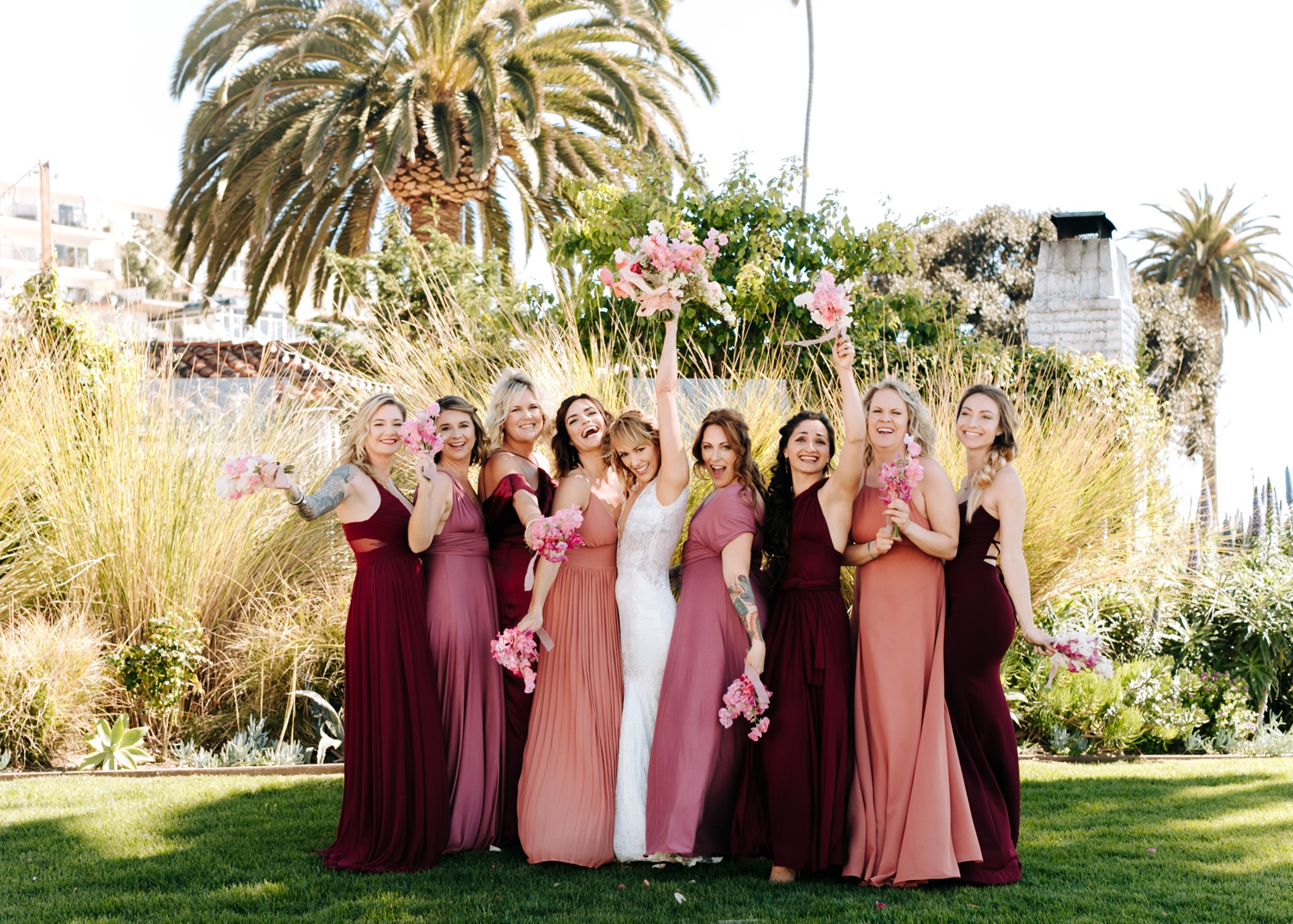 pink and red wedding party dresses, wedding party photos at Casino San Clemente